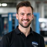 Professional photo of Liam, a certified repair technician, smiling confidently.